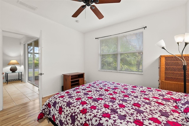 bedroom featuring light hardwood / wood-style floors and ceiling fan