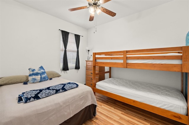 bedroom with hardwood / wood-style floors and ceiling fan