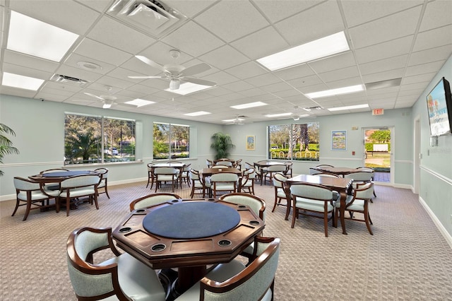 game room featuring light carpet, a drop ceiling, and ceiling fan