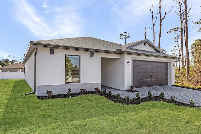3560 Bellefonte Ave, North Port, FL 34286 - single story home featuring stucco siding, an attached garage, decorative driveway, a front lawn, and a shingled roof
