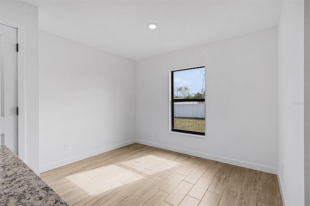 3560 Bellefonte Ave, North Port, FL 34286 - unfurnished room with baseboards and light wood-style flooring