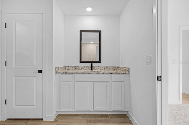 3560 Bellefonte Ave, North Port, FL 34286 - bathroom featuring baseboards, wood tiled floor, and vanity