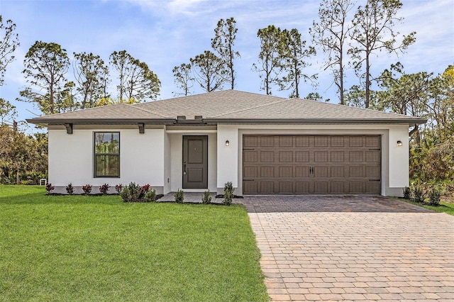 5237 Aberback St, North Port, FL 34291 - single story home featuring stucco siding, roof with shingles, decorative driveway, a front yard, and a garage