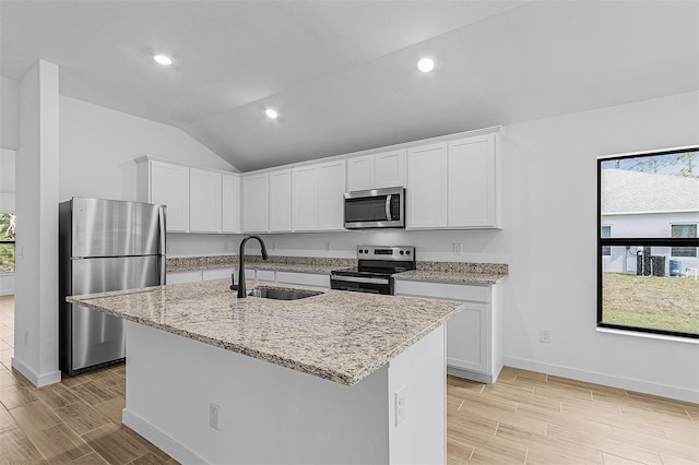 5237 Aberback St, North Port, FL 34291 - kitchen featuring white cabinetry, light stone counters, a sink, and stainless steel appliances