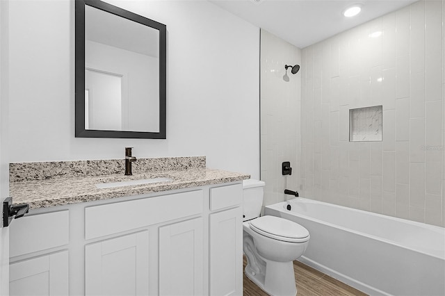 5237 Aberback St, North Port, FL 34291 - full bath with toilet, wood finished floors, bathtub / shower combination, and vanity