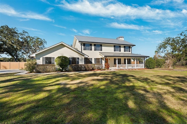 view of front of house featuring a front yard and a porch