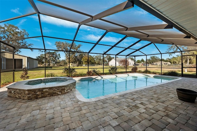 view of pool featuring a lanai, a lawn, a patio, and an in ground hot tub