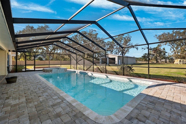 view of swimming pool featuring an in ground hot tub, a patio, and glass enclosure