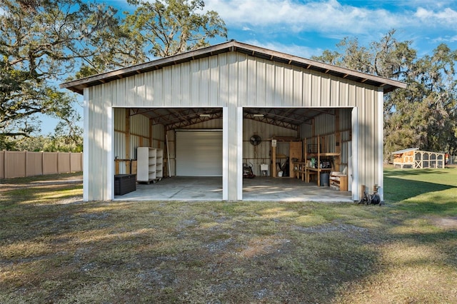 garage featuring a lawn