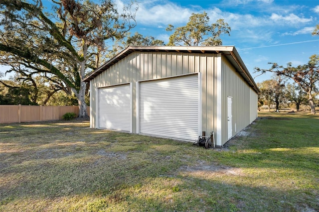 garage featuring a lawn