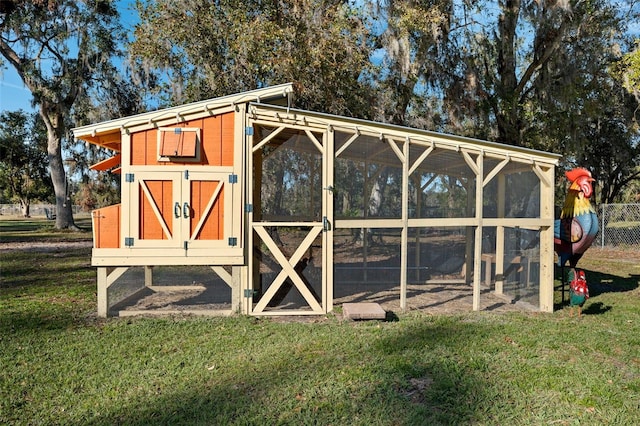 view of outbuilding with a yard