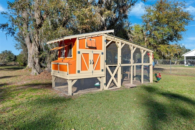 view of outdoor structure with a lawn