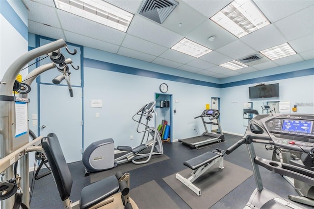 workout area featuring a drop ceiling