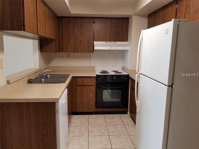 kitchen with sink, white appliances, and light tile patterned floors