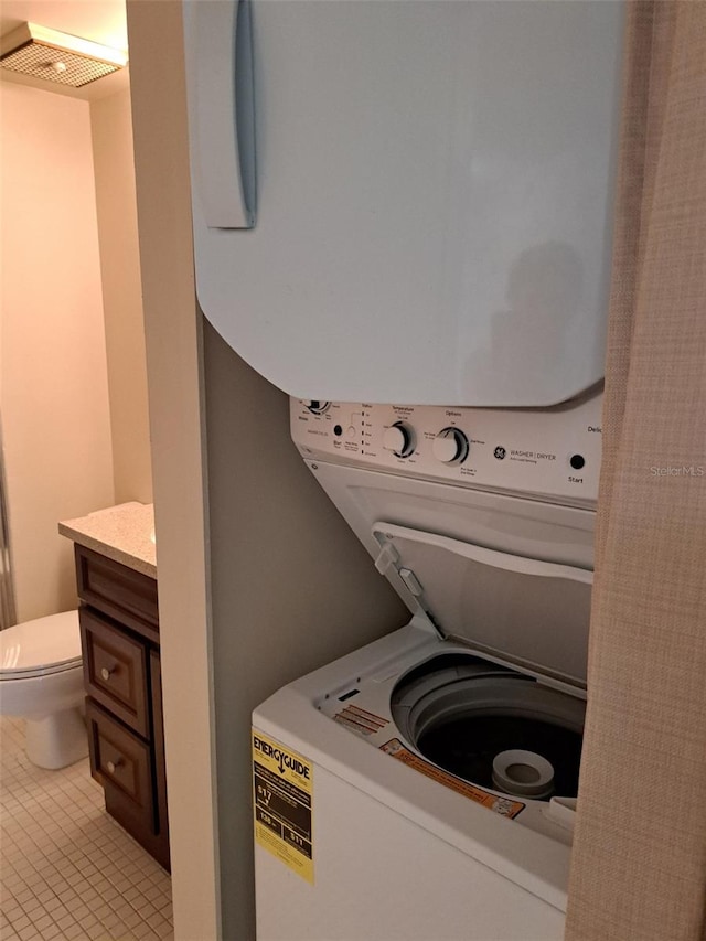 washroom with stacked washer / dryer