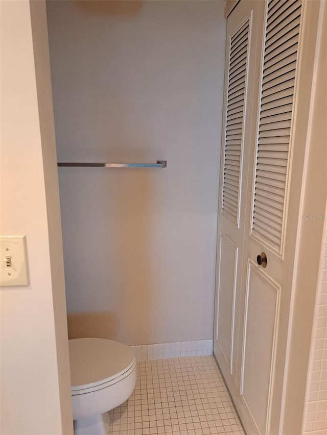 bathroom featuring tile patterned floors and toilet