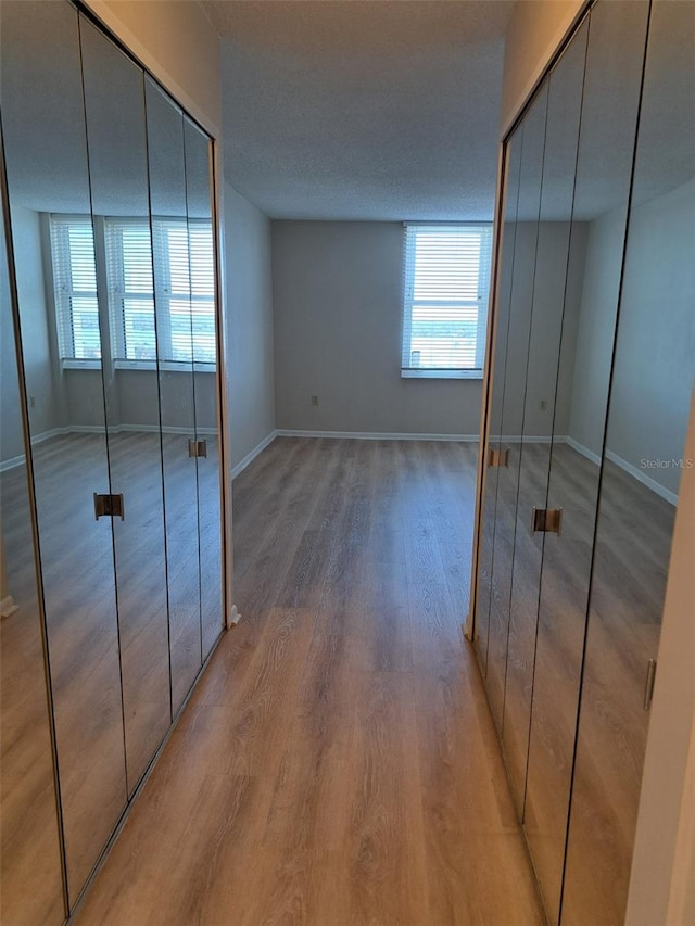 unfurnished bedroom featuring hardwood / wood-style floors