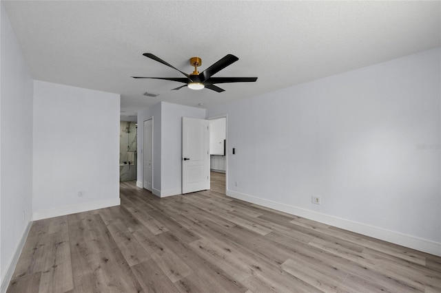 unfurnished bedroom with ceiling fan, a textured ceiling, and light wood-type flooring