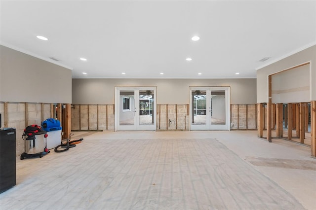 workout room featuring crown molding and french doors