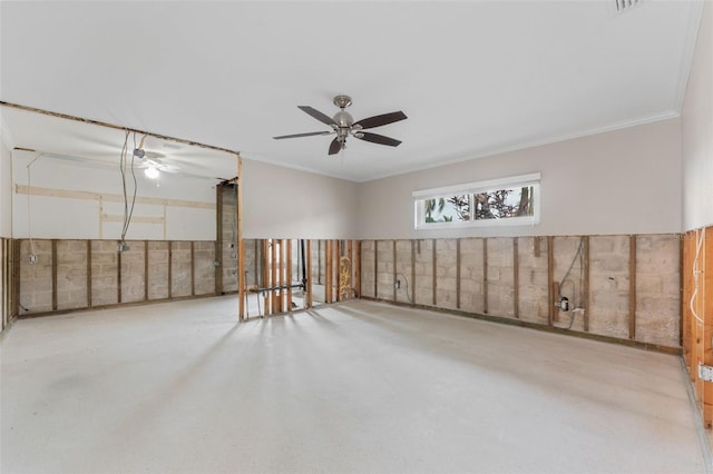 empty room featuring crown molding and ceiling fan