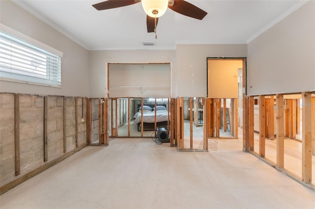 interior space with crown molding and ceiling fan