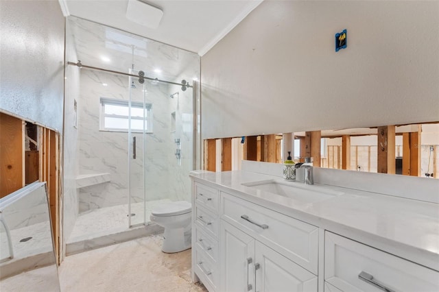 bathroom featuring vanity, toilet, crown molding, and walk in shower