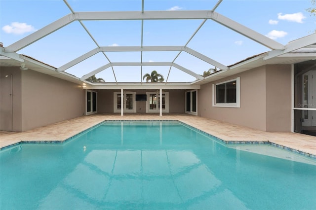 view of pool with a lanai and a patio area