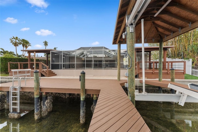 view of dock featuring a lanai