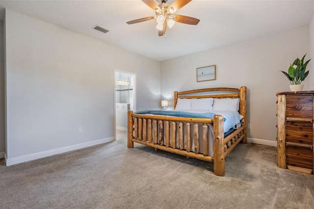 carpeted bedroom with connected bathroom and ceiling fan