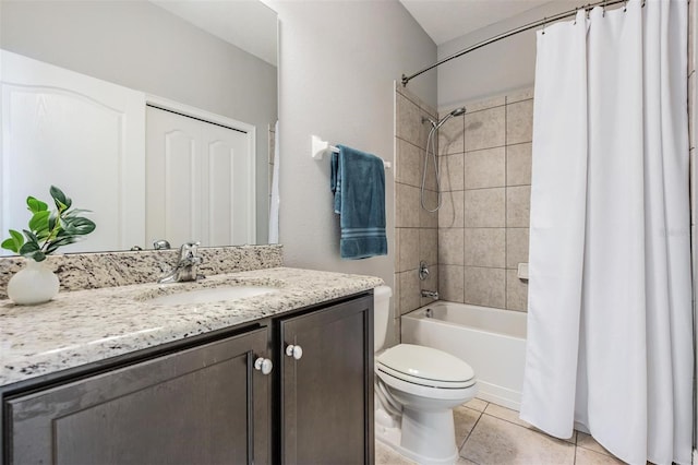 full bathroom with tile patterned floors, vanity, toilet, and shower / bath combo with shower curtain