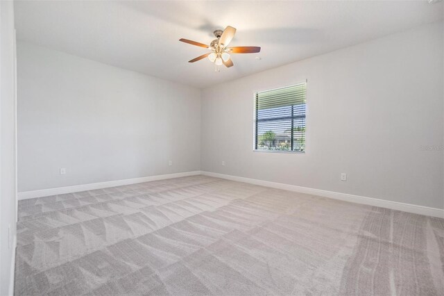 19724 Post Island Loop, Land O Lakes, FL 34638 - spare room with light carpet, ceiling fan, and baseboards