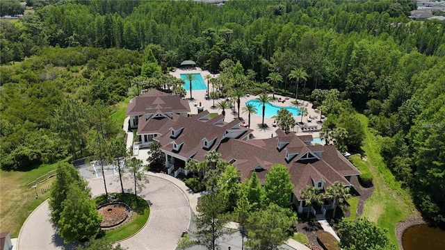 19724 Post Island Loop, Land O Lakes, FL 34638 - aerial overview of property's location with a pool and a heavily wooded area