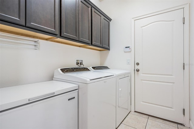 19724 Post Island Loop, Land O Lakes, FL 34638 - laundry room featuring washer and dryer, cabinet space, and light tile patterned floors