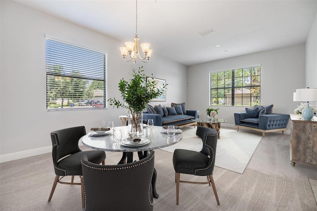 19724 Post Island Loop, Land O Lakes, FL 34638 - dining area featuring a chandelier, baseboards, and light colored carpet