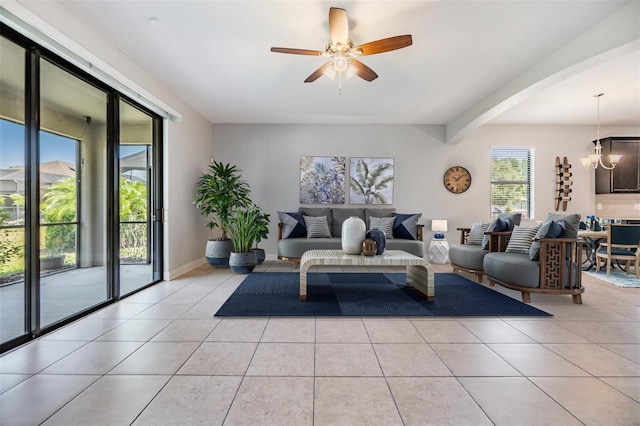 19724 Post Island Loop, Land O Lakes, FL 34638 - living area featuring light tile patterned floors, a ceiling fan, a chandelier, and arched walkways