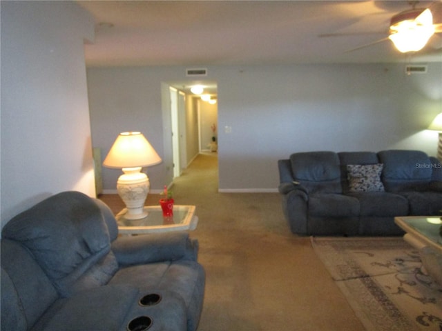 living room featuring ceiling fan and carpet flooring