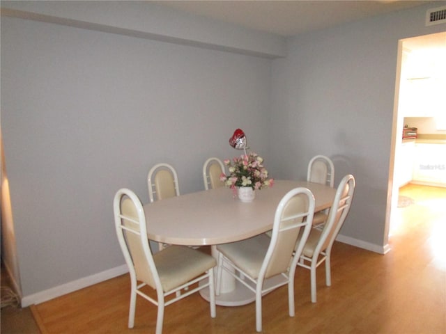 dining room featuring hardwood / wood-style flooring