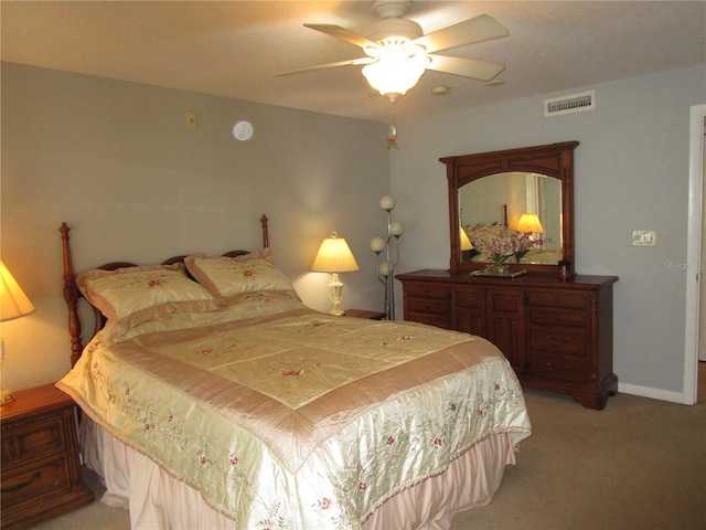 bedroom featuring light colored carpet and ceiling fan