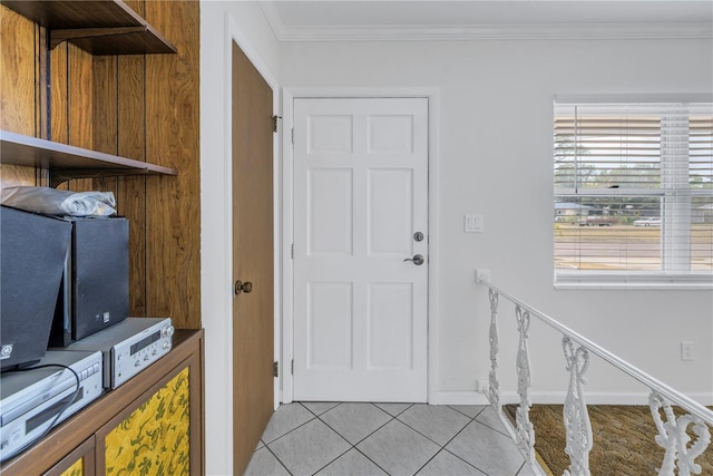 tiled foyer with crown molding