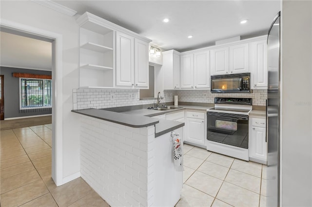 kitchen featuring white cabinetry, electric range oven, light tile patterned floors, and kitchen peninsula