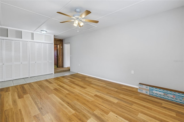 unfurnished bedroom with light hardwood / wood-style floors and ceiling fan