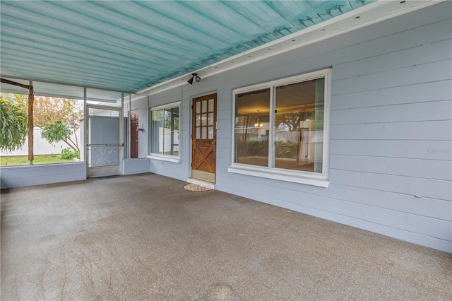 unfurnished sunroom featuring wooden ceiling