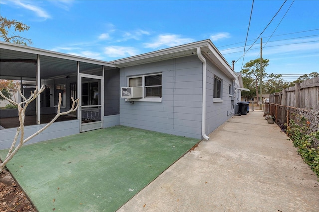 rear view of house with a sunroom