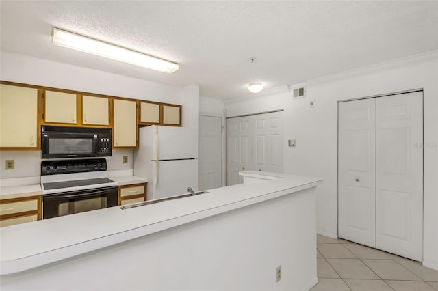 kitchen featuring light tile patterned flooring, sink, a textured ceiling, range with electric stovetop, and white fridge