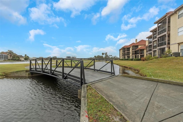 dock area featuring a water view and a yard