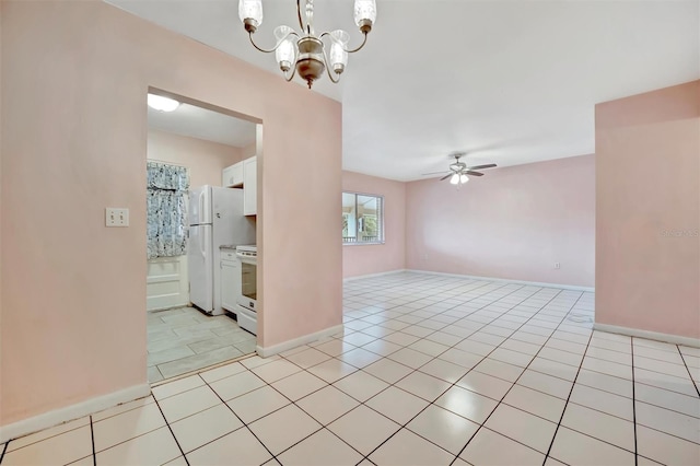 spare room featuring ceiling fan with notable chandelier and light tile patterned floors