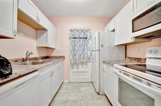 kitchen featuring sink, white appliances, light tile patterned floors, light stone countertops, and white cabinets