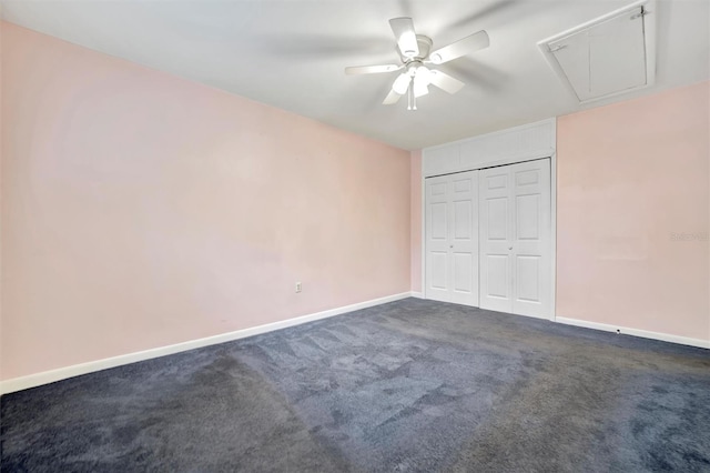 unfurnished bedroom featuring ceiling fan, a closet, and dark colored carpet