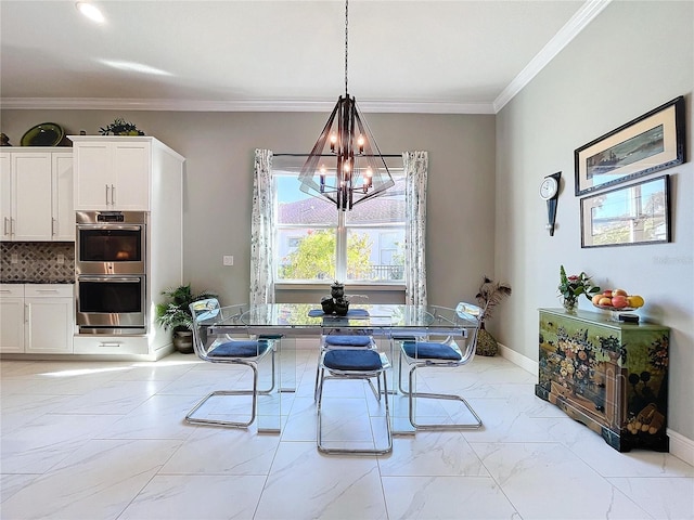 dining space with ornamental molding and a chandelier