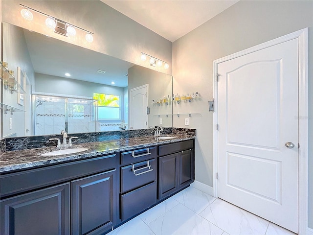 bathroom featuring vanity and an enclosed shower